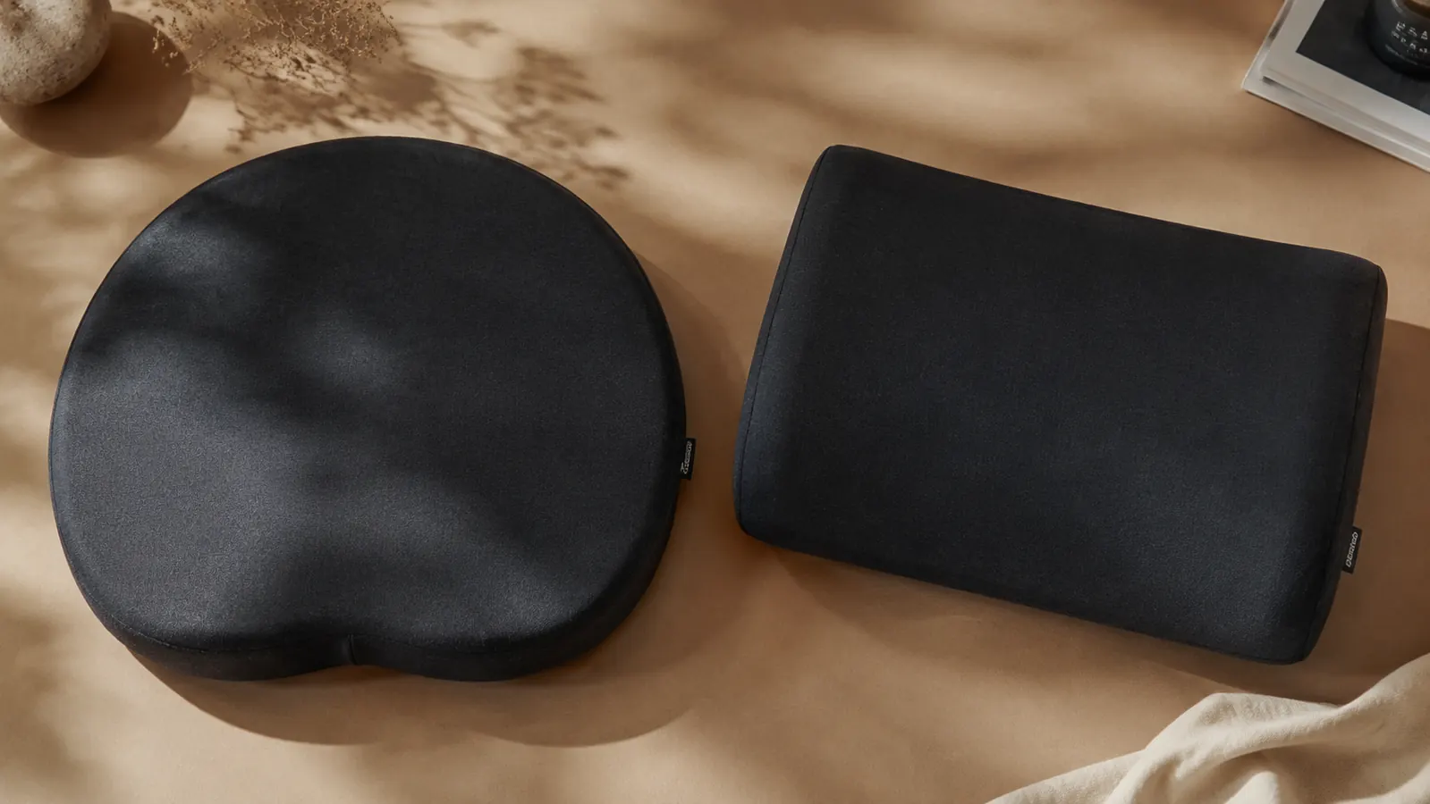 Person sitting comfortably at a home office desk with a memory foam seat cushion on their chair